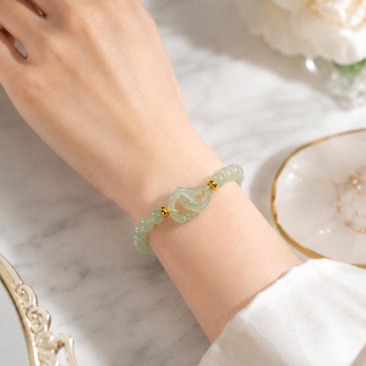 Bracciale con perline in giada simulata, elegante gioiello in vetro verde, regalo per donna (Cuore a cuore)